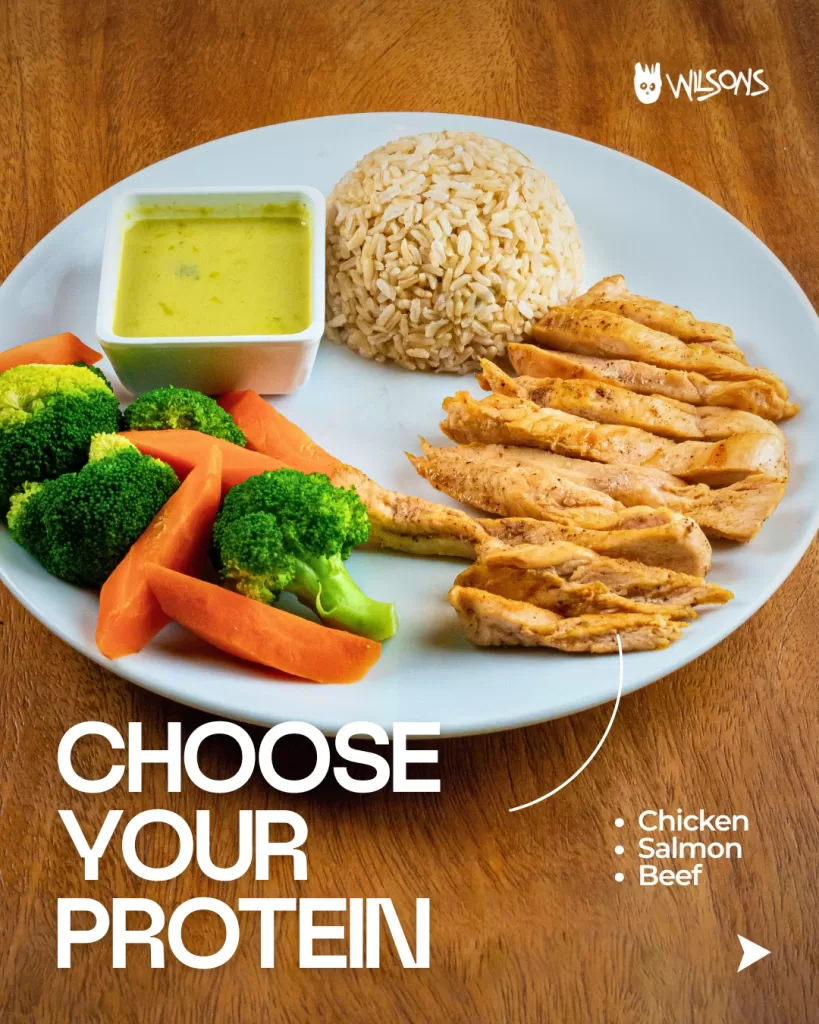 Grilled chicken dinner with rice, veg, and green curry sauce at Wilson’s Cafe Phuket